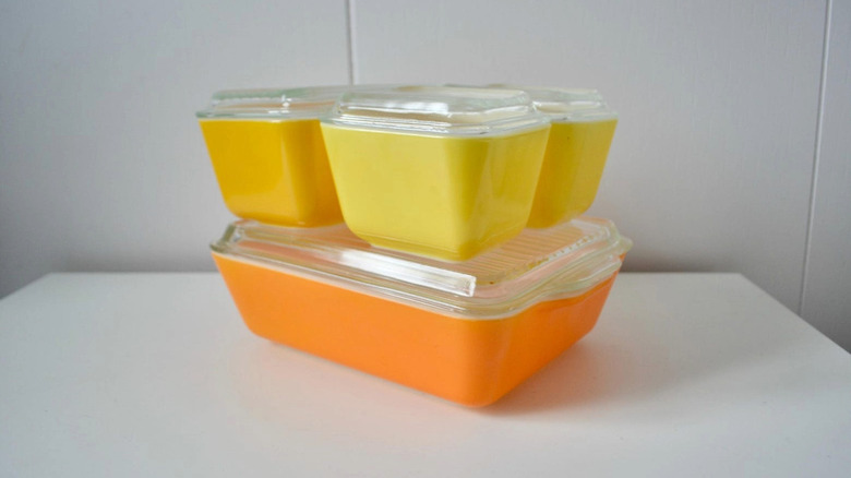 Bright yellow and orange stackable Pyrex fridgies