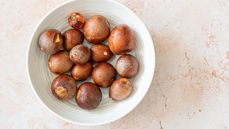Avocado pit seeds saved in a bowl.