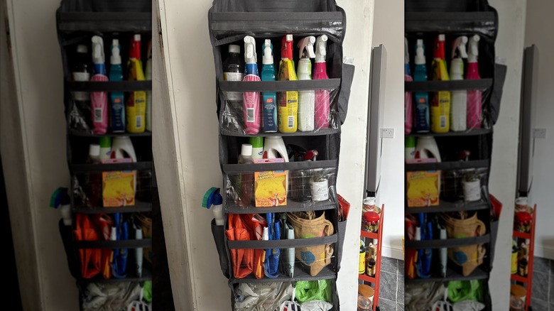 An over-the-door organizer filled with cleaning supplies