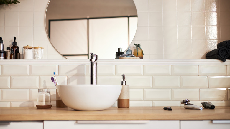 Bathroom counter with toiletries on it