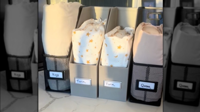 Using magazine or file holders for linen storage