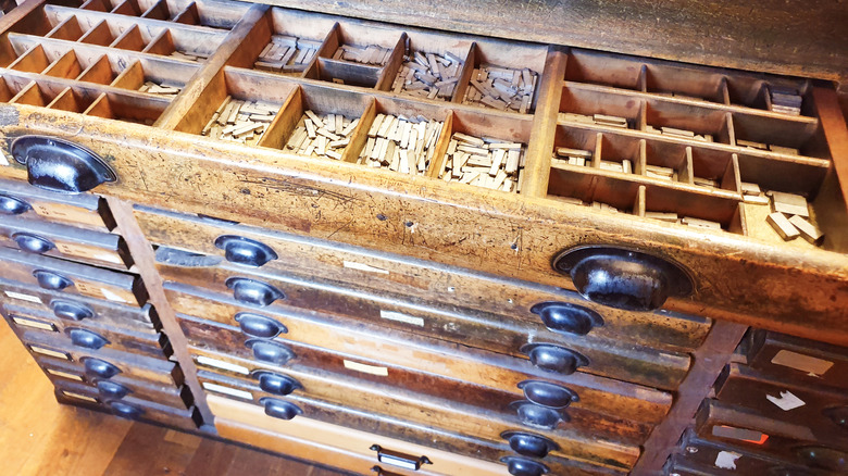 Typeset cabinet with the drawers open.