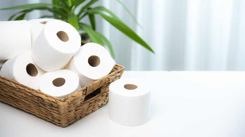 Toilet paper rolls in a wicker basket