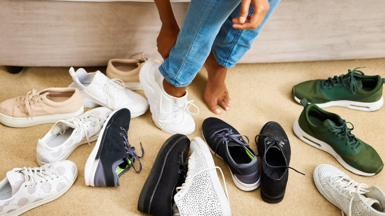 Person trying on different shoes