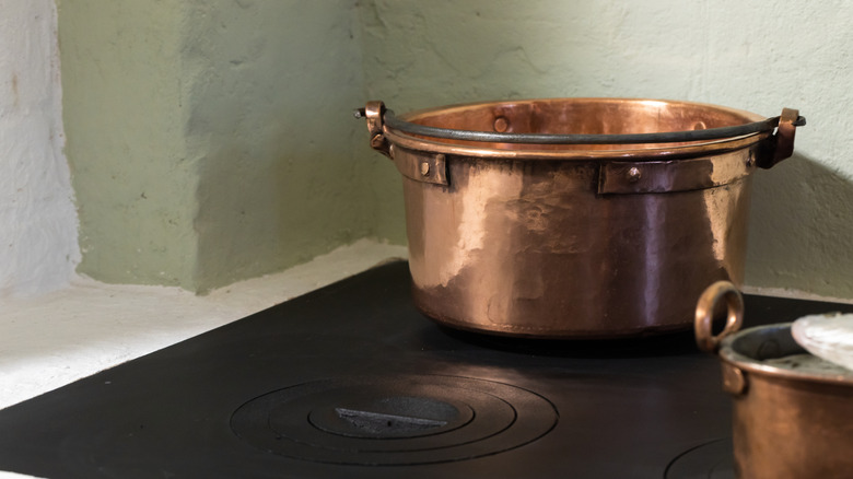 shiny hammered copper pot stove