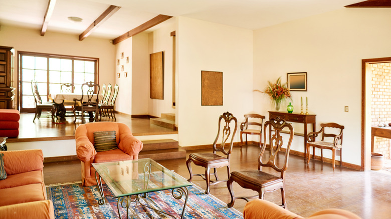Warm off-white, yellowish walls in furnished room.