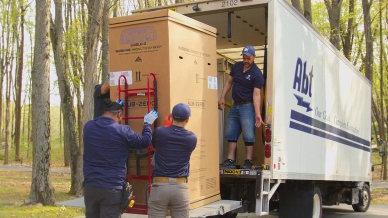 Abt Electronics team delivering a refrigerator