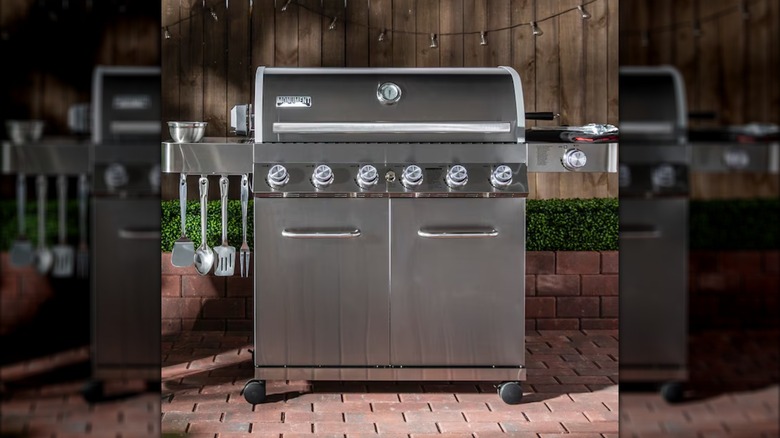 Monument Grills' 77352 Six-Burner Gas Grill on a brick patio