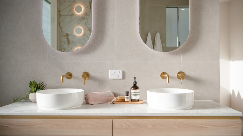 Bathroom with styling with double vanity.