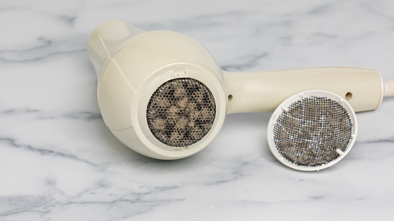 Hair dryer air vent filled with lint