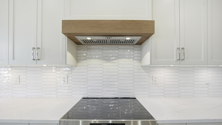 Closeup of a stove and overhead vent