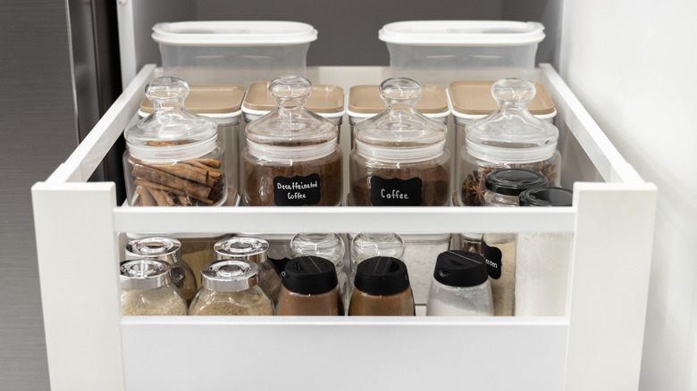 closeup of kitchen spices on a shelf in a drawer