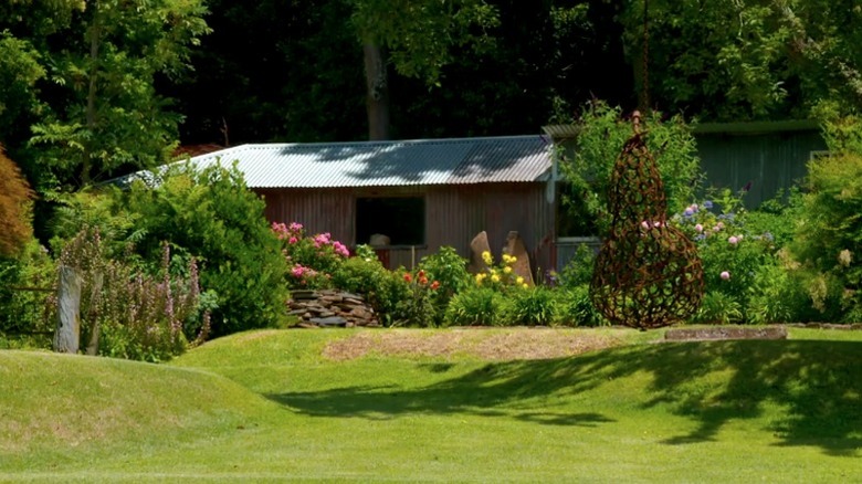 A large garden with a range of grassy land forms.