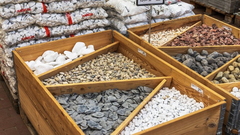 Different landscaping materials displayed in a hardware store.