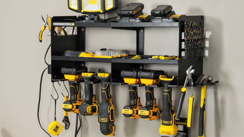 Permasteel power tool organizer holds several power and hand tools on a garage wall