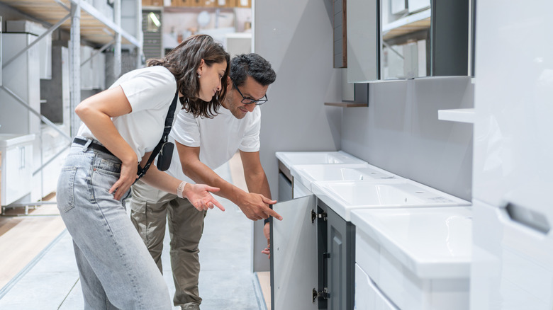 A couple shopping for a bathroom vanity