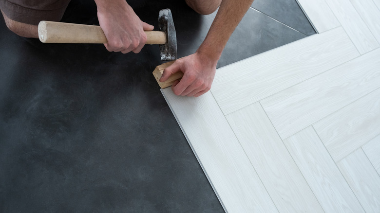 Man installing quartz tiles