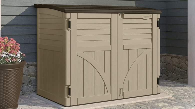 Horizontal shed on the side of a house