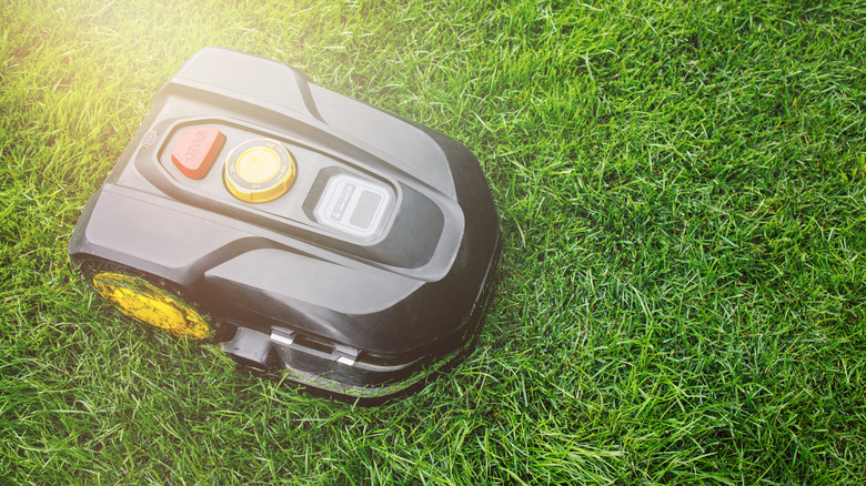 A robotic lawn mower receiving direct sunlight