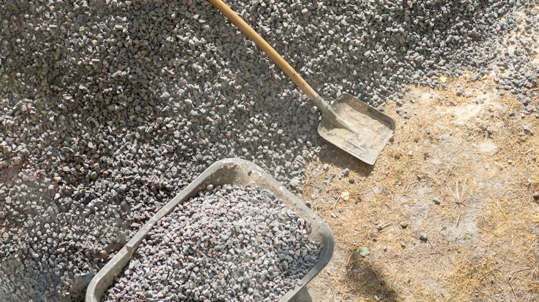 install a layer of crushed granite on a gravel pathway base