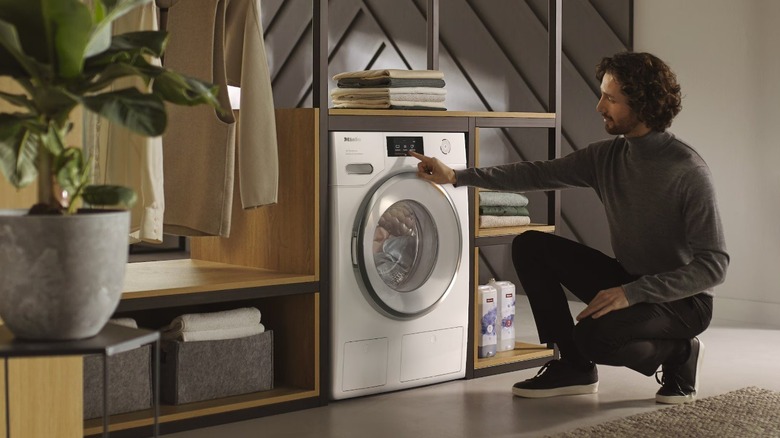 Man using a Miele washing machine