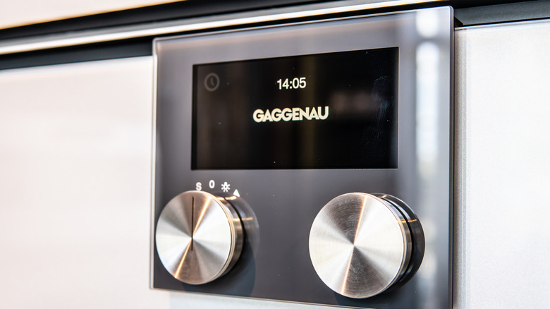 a close-up shot of a Gaggenau appliance, focusing on the two knobs