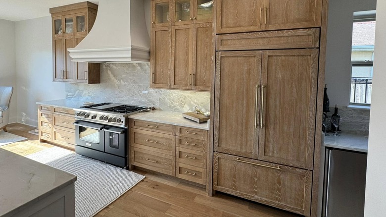 Modern kitchen with cerused oak cabinetry and gas stove.