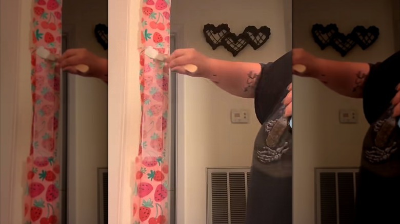 decoupage door frame trim using strawberry print paper
