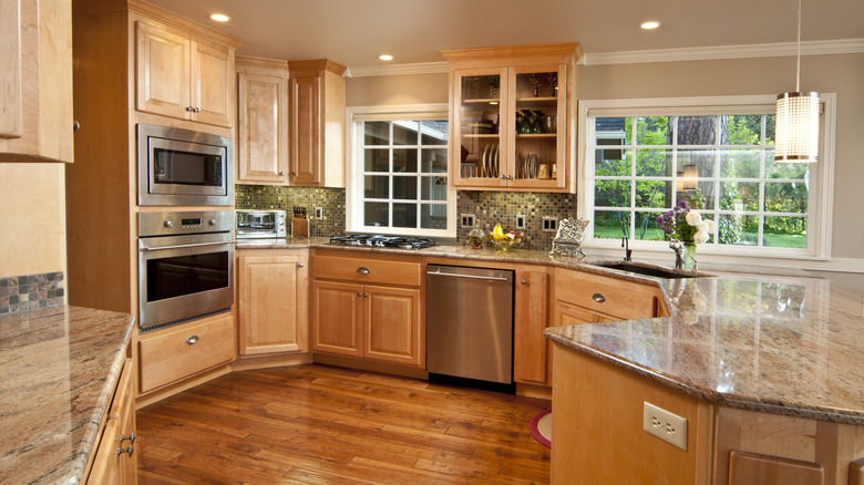 A '90s kitchen with honey oak cabinets