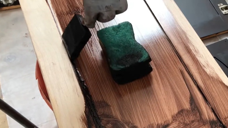 Dark-stained kitchen cabinet job finished