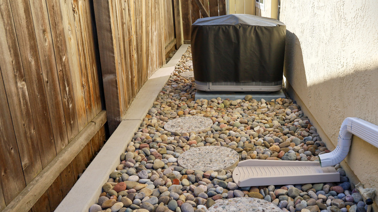 A walking path outside a home with Mexican beach pebbles.