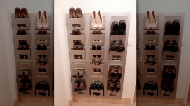 A wall-mounted magazine rack filled with shoes.