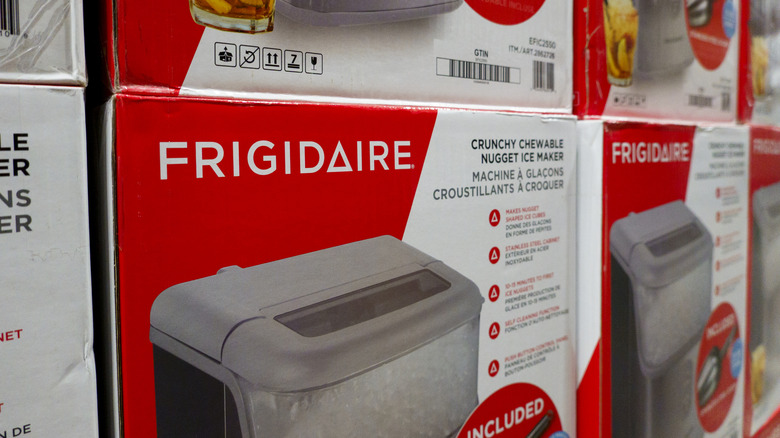 Stacks of nugget ice makers in boxes at a store