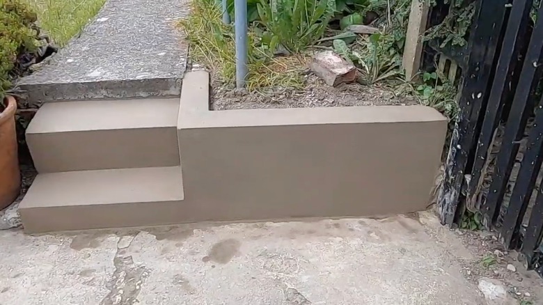 Rendered retaining wall in garden