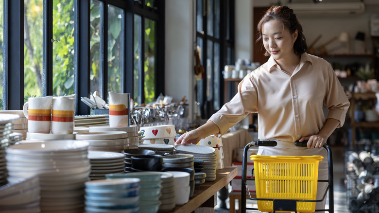 Woman shopping for dishware
