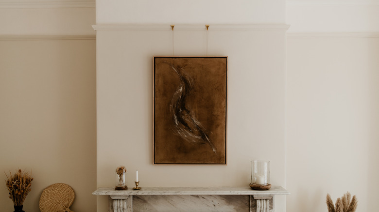 Art hanging above a mantel