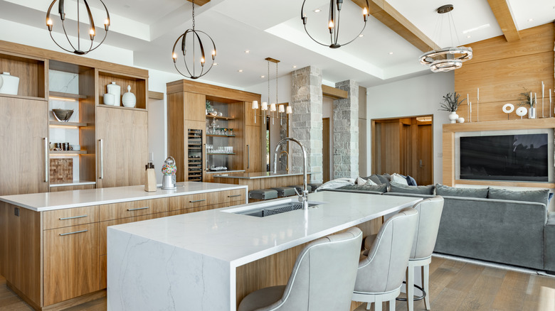 A luxury kitchen with wooden ceiling beams.