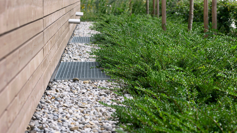 Gravel path next to home foundation