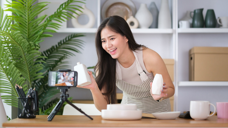Content creator showing off home products