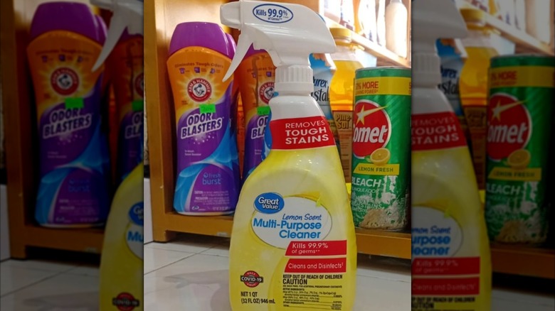 Bottle of Walmart Great Value Lemon Scent Multi-Purpose Cleaner in front of a shelf full of other cleaning supplies