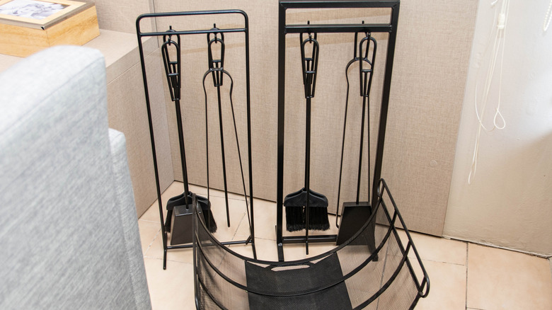 Fireplace tool sets, including coal brushes