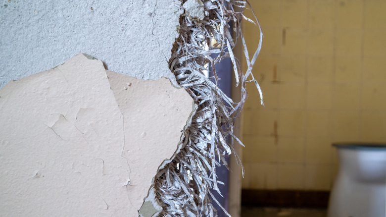 Asbestos in damaged wall