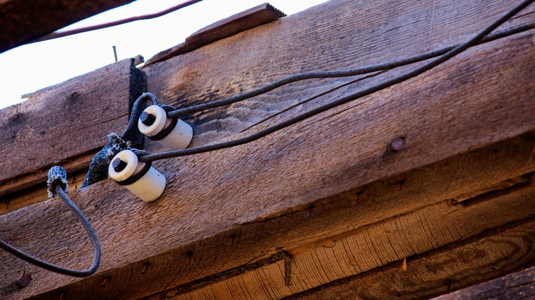 Closeup of knob and tube installation in old house