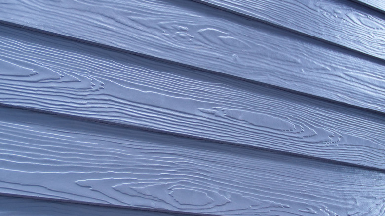 Close up of blue Masonite siding