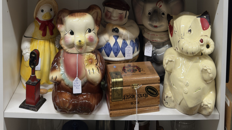vintage cookie jars displayed in secondhand shop