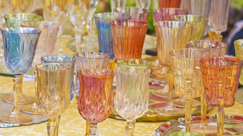 Sale of old multi colored and decorated glasses in a flea market for the sale of second hand products