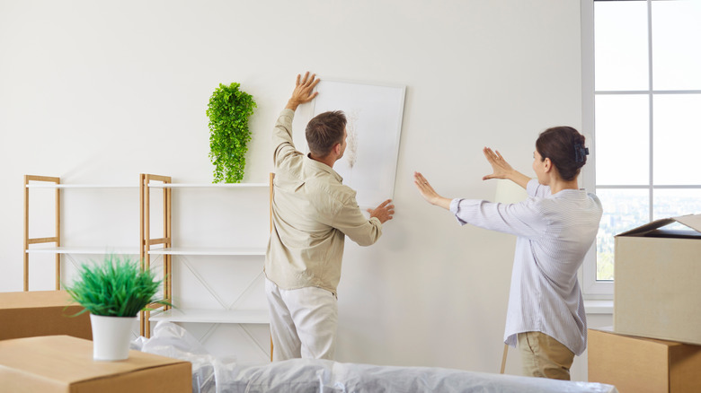 couple planning a collage wall