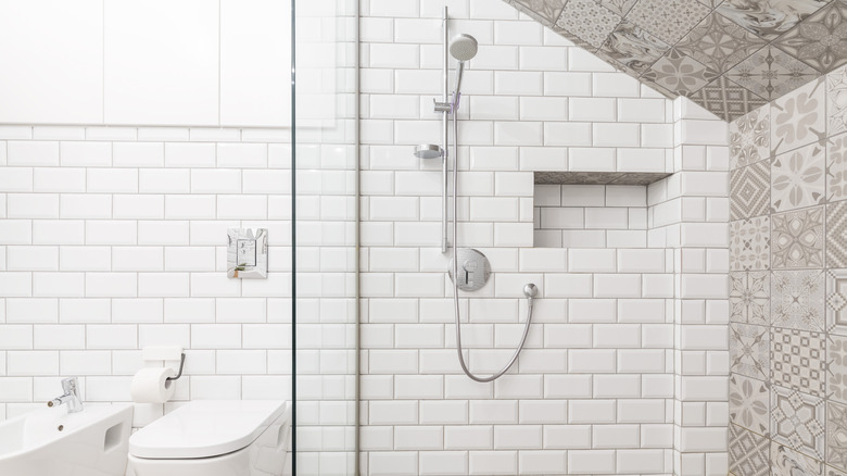 shower with white subway tile