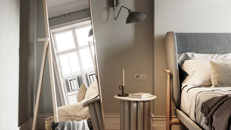 Mirror in bedroom reflecting window