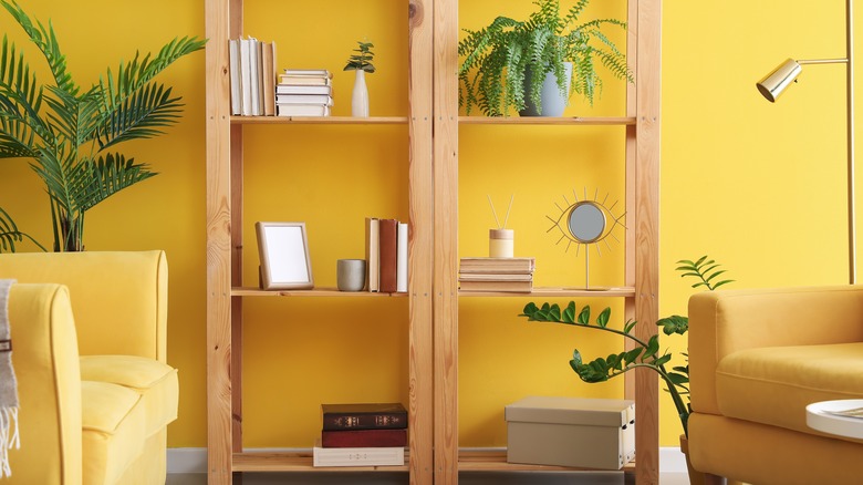 shelves in yellow living room